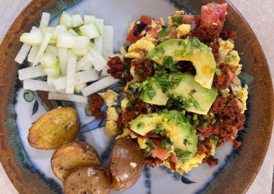 Scrambled farm fresh eggs with chorizo, bacon and avocado at zandoyo bed & breakfast