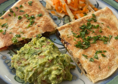Quesadillas with guacamole and salad at zandoyo bed & breakfast