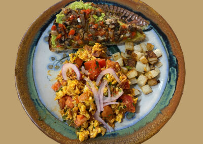 Scrambled eggs with chorizo and bacon at zandoyo bed & breakfast