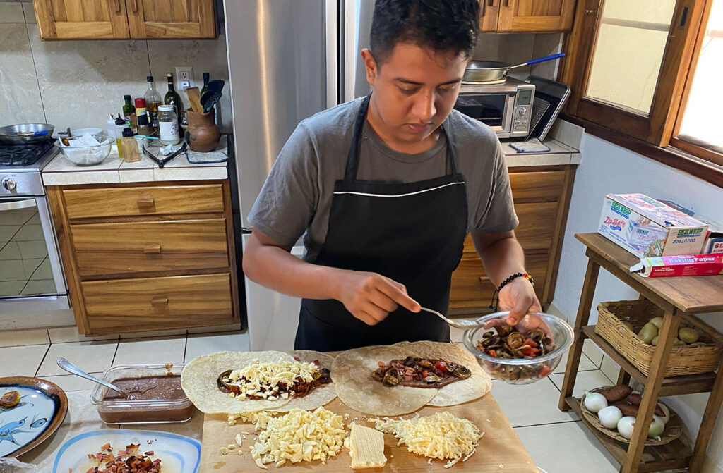 preparing burritos at zandoyo bed and breakfast in puerto escondido